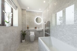 Jetted tub, hair dryer, towels, soap