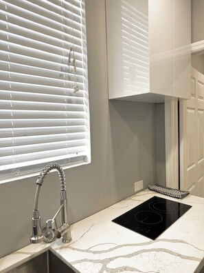Fridge, microwave, stovetop, coffee/tea maker