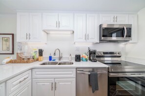 Fridge, microwave, oven, stovetop - Oceanfront 2BR Escape • Private Balcony (Virginia Beach)