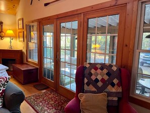 Smart TV, fireplace, books, computer monitors