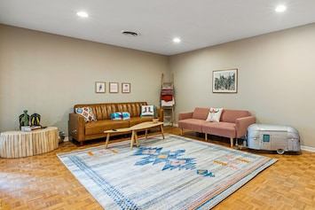 Cohesive decor with two sofa's in the living room. Sofa's lay flat for sleeping