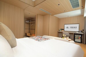 Premium bedding, down comforters, memory foam beds, free minibar