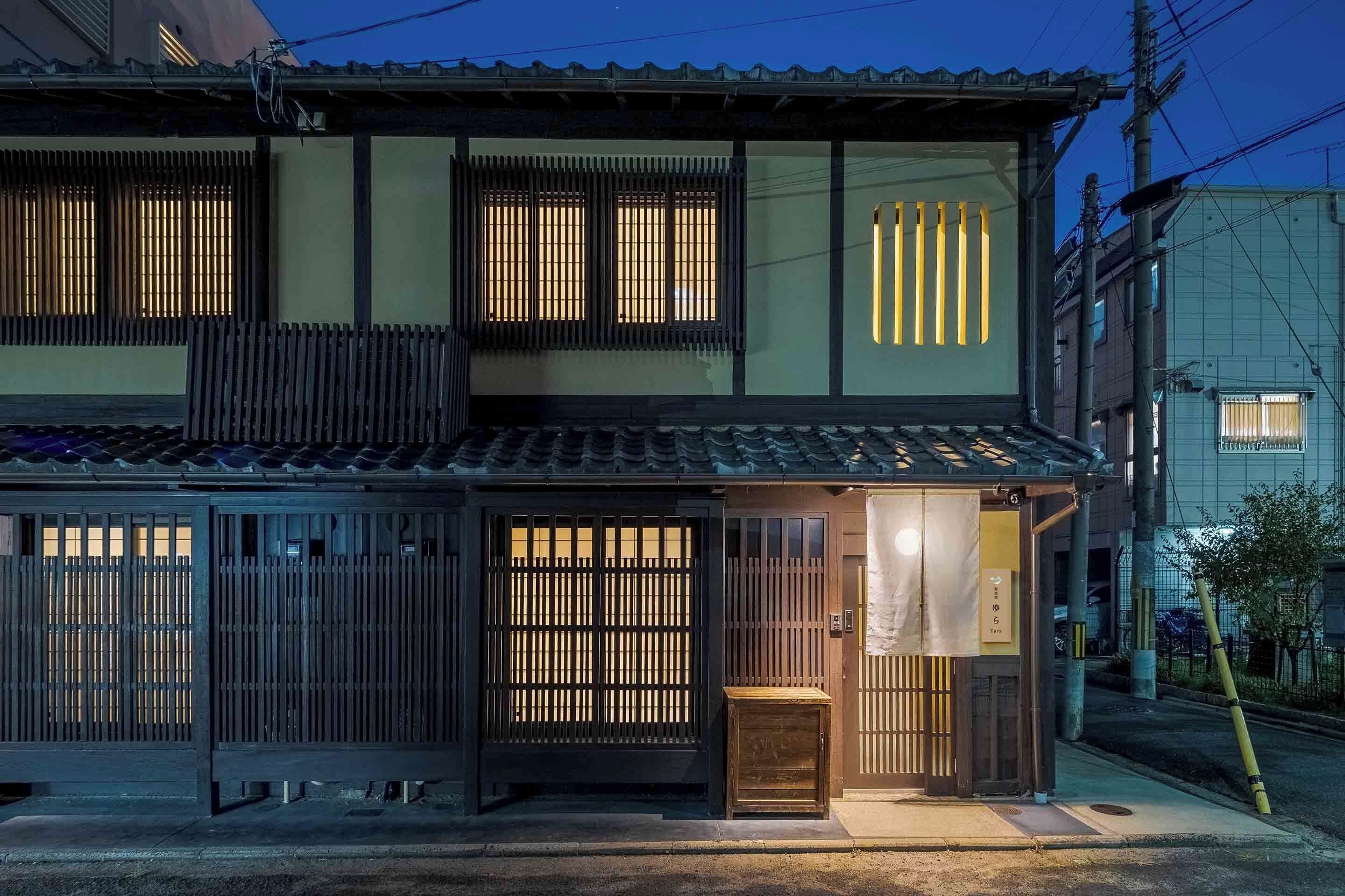 A traditional Japanese building with sliding doors and a small entrance.