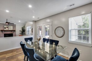 Enjoy meals in this dining area with a glass-top table and six comfortable chairs.