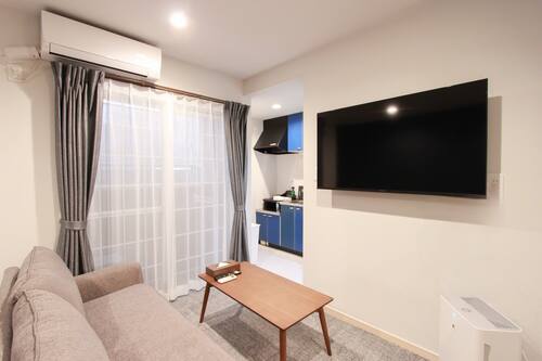 Comfort Apartment | Living area | Flat-screen TV