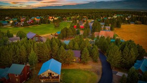 An aerial view of a small town with houses, a main road, and a river. - The Black Bear Escaped! Hot Tub, Fire Pit , Yellowstone, Golf Course! (Island Park)
