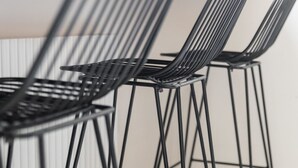 A close-up of black metal chairs with a modern design. - Weaver Suites 2 By Dimorra (NAPOLI)
