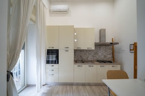 Fridge, oven, coffee/tea maker, cookware/dishes/utensils