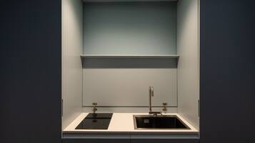 Fridge, microwave, coffee/tea maker, cookware/dishes/utensils