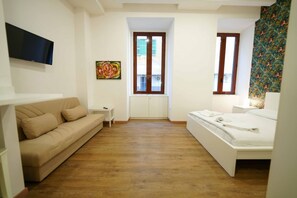 A bedroom with a bed, a sofa, a TV, and a window. - Neapolitan Soul 1 By Dimorra (Napoli)