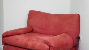 A red upholstered chair against a white wall. - Neapolitan Soul 3 By Dimorra (Napoli)