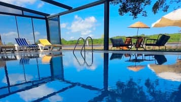 Outdoor pool, open 10:00 AM to 8:00 PM, free pool cabanas