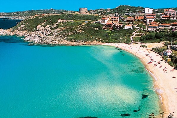 On the beach, sun loungers, beach towels
