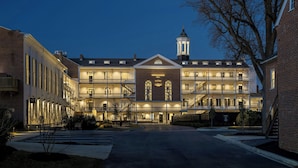 A multi-story hotel with a central entrance, a bell tower, and a brick facade. - Visitation Hotel Frederick, a Tribute Portfolio Hotel (Frederick)