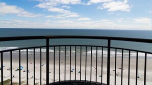A balcony with a view of a beach and ocean. - Roomy Oceanfront Ste Includes Breakfast 15th Flr (Myrtle Beach)