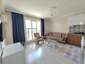 Comfort Condo | Living area | TV