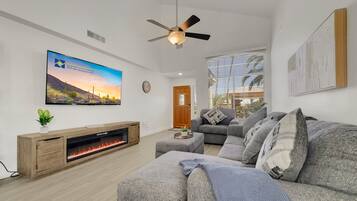 Smart TV, fireplace, books, offices