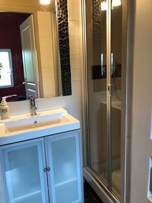 Shower, hair dryer, towels, soap