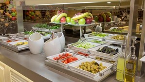 A buffet with various food items including fruits, vegetables, and olives. - İcon Hotel Bomonti (Istanbul)