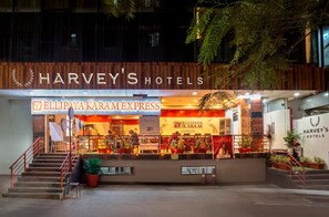 A hotel with a restaurant named 'Ellipaya Karam Express' in front. - Harvey's Hotels (Hyderabad)
