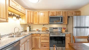 Dishwasher, coffee/tea maker, cookware/dishes/utensils, dining tables