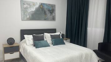 Luxury Apartment, City View | 1 bedroom, in-room safe, blackout curtains, iron/ironing board