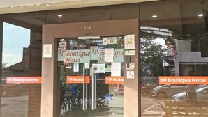 The entrance to the YP Boutique Hotel with multiple signs indicating the hotel's name and a visible address number. - YP Boutique Hotel, Paradigm Mall Petaling Jaya (Petaling Jaya)