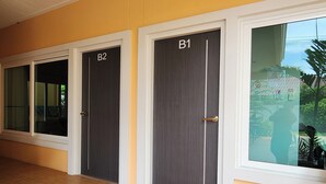 A hallway with three doors labeled B1, B2, and B3. - 99 House (Pattaya)