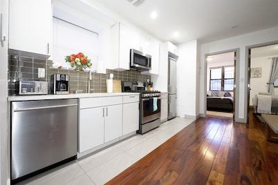 Family-Friendly Duplex Near Subway | Patio + Games