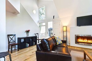 TV, fireplace, books, offices