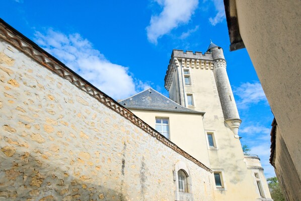 A historic building with a stone facade and a tower.