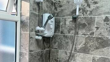 Apartment | Bathroom | Combined shower/tub, deep soaking tub, towels, toilet paper