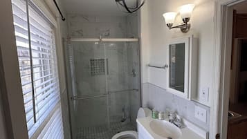 Shower, hair dryer, towels, soap