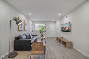 Standard Apartment, 2 Bedrooms, Patio | Living area | 32-inch Smart TV with satellite channels