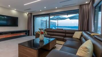 Villa (Four Bedroom Villa with Private Pool) | Living room | 32-inch flat-screen TV with satellite channels