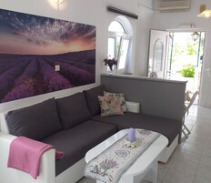 Apartment (One Bedroom Apartment with Shared Ter) | Living room | 32-inch flat-screen TV with digital channels