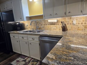 Fridge, microwave, oven, stovetop - Two-bedroom townhome in a quiet neighborhood with private parking and Wi-Fi. (Bryan)