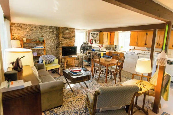 Charming living room with an open concept to the dining table and kitchen.
