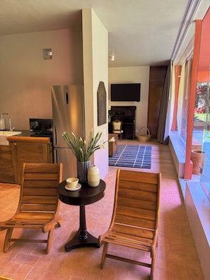 Premium Room | Living area | 50-inch Smart TV with cable channels, TV, pay movies
