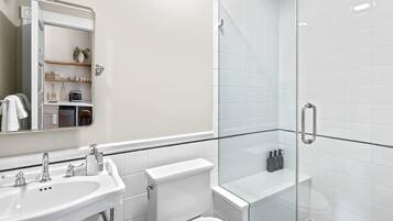 Shower, hair dryer, towels, shampoo