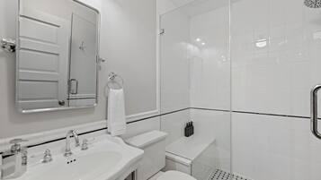 Shower, hair dryer, towels, shampoo