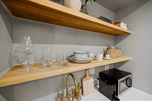 Coffee/tea maker, fridge, microwave, cookware/dishes/utensils