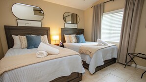 A hotel room with two beds, each with a headboard, a bedside table with a lamp, and a window with curtains. - Mountain Retreat 4 Miles to Park Entrance Walk to Dining (Three Rivers)