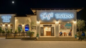 Tony's Taverna with an 'Authentic Greek Cuisine' sign, a welcoming entrance, and a 'Grand Opening' banner. - Mountain Retreat 4 Miles to Park Entrance Walk to Dining (Three Rivers)