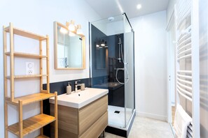 Shower, hair dryer, towels, soap