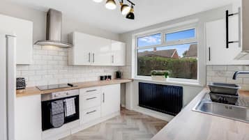 Fridge, microwave, oven, dining tables