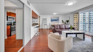A modern apartment with a kitchen, dining area, and living room. - The Club 1601 · Ocean View Amazing Unit Brickell (Miami)