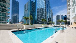 A rooftop pool with a clear view of modern high-rise buildings in the background. - The Club 1601 · Ocean View Amazing Unit Brickell (Miami)
