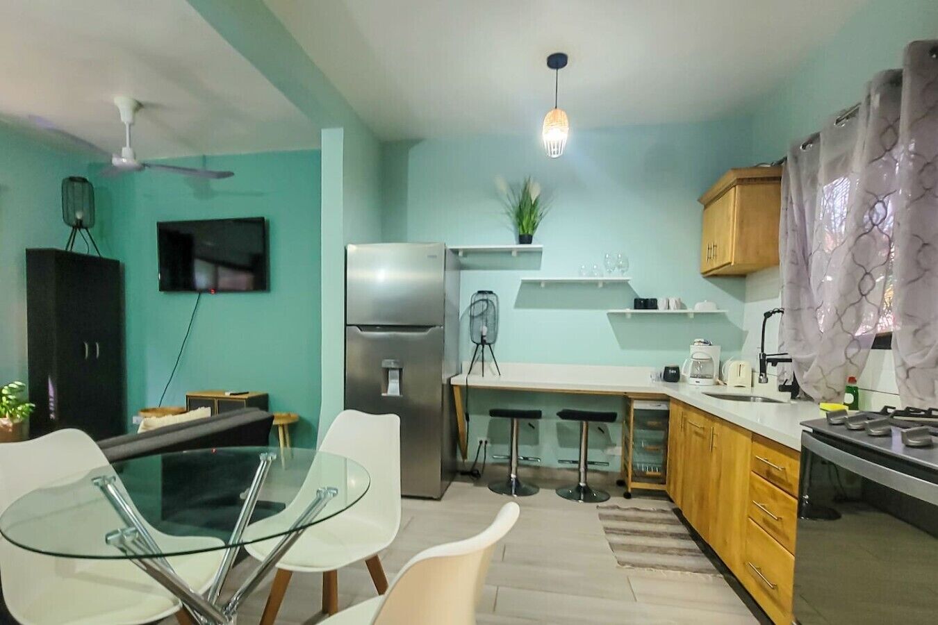 Fridge, microwave, coffee/tea maker, cookware/dishes/utensils
