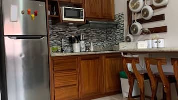 Fridge, microwave, stovetop, coffee/tea maker